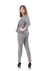 Young beautiful blonde woman in gray trousers