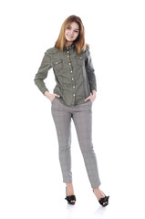 Young beautiful blonde woman in gray trousers