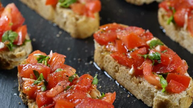 Classic Italian bruschetta, tomato, garlic and parsley on toasted bread