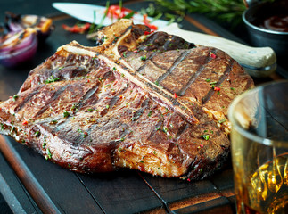 Barbecued t-bone steak seasoned with herbs