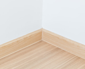 Naklejka na ściany i meble Wall and wooden laminate floor in the room