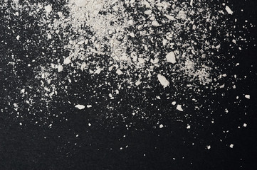 Crumbled white Powder Texture on black Backround