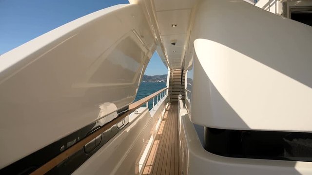 Large lateral passageway on a luxury yacht.