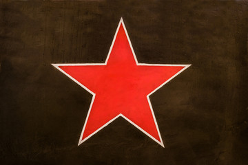 Red Soviet star on a dark green protective camouflage background. Identification sign aircraft of the Soviet air force on the khaki background.