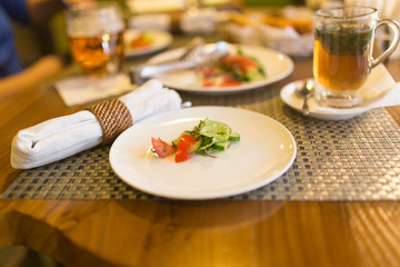 Dish with tomatoes and cucumbers in a restaurant