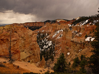 Bryce Canyon National Park, a sprawling reserve in southern Utah, is known for crimson-colored hoodoos, which are spire-shaped rock formations.