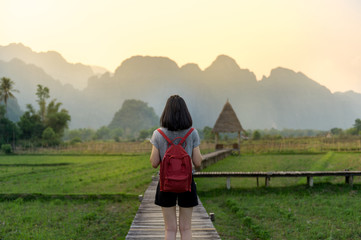 Female tourist in front of a breathtaking landscape in Vang Vieng Loas - 142506136