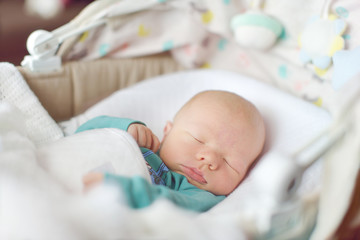 newborn sleeping in crib