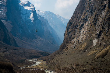 Helicopter flying over Himalaya range