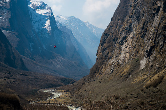 Helicopter flying over Himalaya range