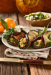 Fototapeta na wymiar eggplant rolls stuffed with rice and vegetables