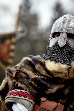 Portrait of a warrior. Knight in armor. Medieval battle (historical reconstruction)