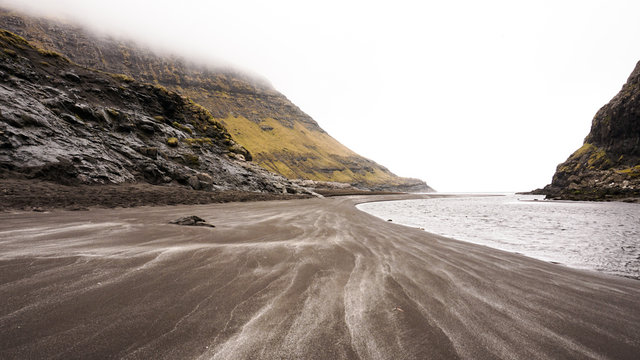 Black sandy beach in Saksun, Faroe Islands