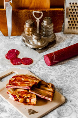 On the plank lies smoked meat
