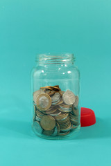 Brazilians Coins inside the glass pot