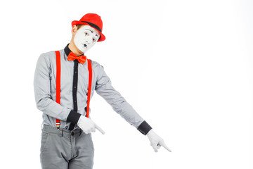 Portrait of a man, artist,clown, MIME. Shows something, isolated on white background