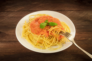 Plate of spaghetti with tomato sauce and copyspace