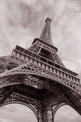 Fototapeta na wymiar Eiffel Tower in Black and White Sepia Tone against clouded sky; Paris; France