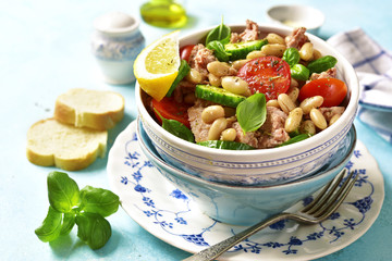 Vegetable salad with tuna and herbs.