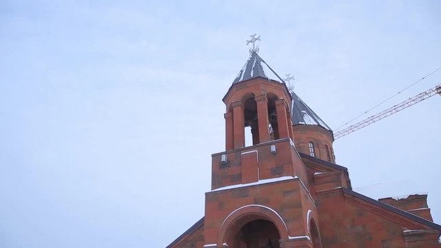 the Christian Church in winter. Famous Saint Gregory Tigran Honents church is surrounded with winter landscape. The Church is of red brick in Armenia. Ani is a ruined medieval Armenian city-site