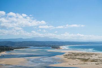 Beach and Coastline with Inlet and Houses Seen from a Lookout at Plettenberg Bay in South Africa