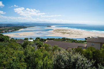 Beach and Coastline with Inlet and Houses Seen from a Lookout at Plettenberg Bay in South Africa