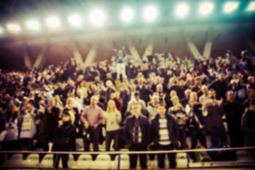 Naklejka premium blurred background of crowd of people in a basketball court