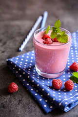 Glass of refreshing raspberry milkshake for breakfast