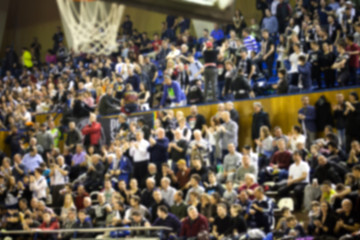 blurred background of crowd of people in a basketball court