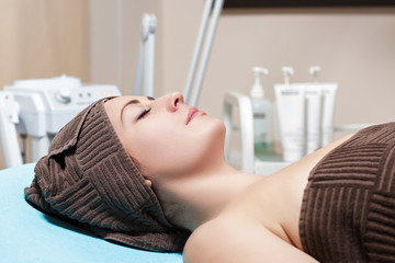 young brunette woman waiting for Spa treatment in Spa salon. cosmetology
