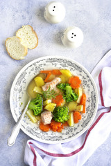 Vegetable soup with salmon.Top view.