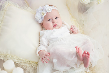 Little baby girl in a beautiful dress