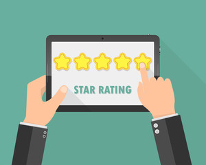 Hands holding a tablet with rating stars. Vector illustration