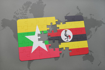 puzzle with the national flag of myanmar and uganda on a world map