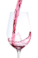 Red wine pouring into a wineglass