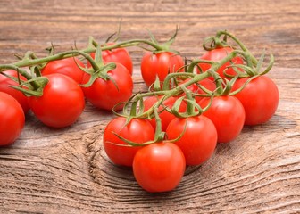 ripe tomatoes on wood background