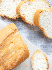 Fresh bread and slices for breakfast closeup view from above