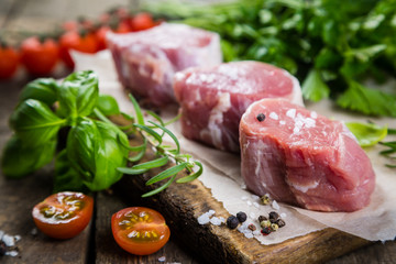 Raw filet mignon meat cuts with spice and herbs