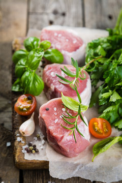 Raw filet mignon meat cuts with spice and herbs