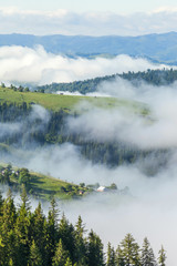 Majestic view on beautiful fog mountains in mist landscape. Dramatic unusual scene. Travel background. Exploring beauty world. Carpathian mountains. Ukraine. Europe.