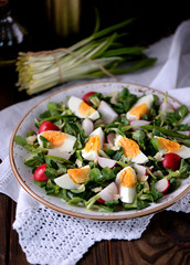 Spring green salad from organic radish, wild garlic with boiled eggs, olive oil and parmesan.