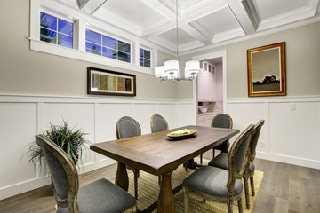 Lovely craftsman style dining room with coffered cealing