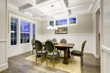 Lovely craftsman style dining room with coffered cealing