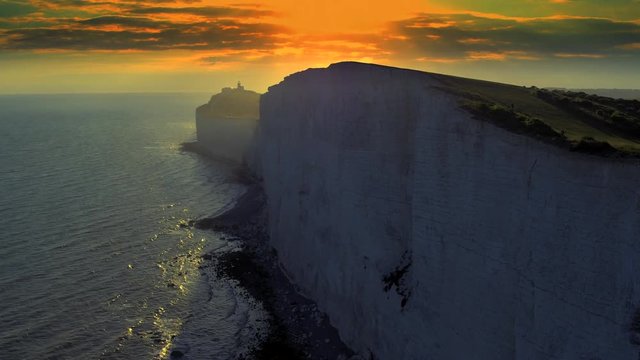 White chalk cliffs and Beachy Head Lighthouse. Eastbourne, East Sussex, England