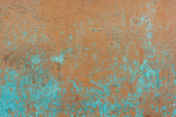 Brown cracked painting on wooden surface