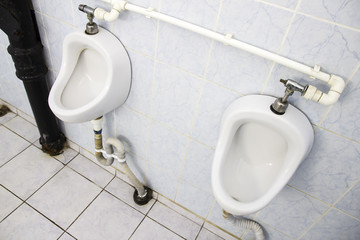 Dirty urinals in public toilet for men