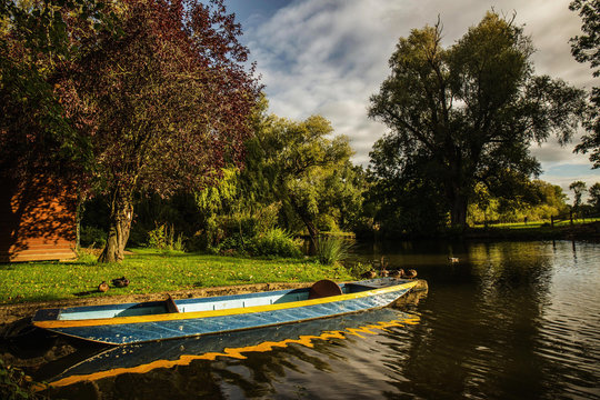 Oxford University Park, Oxfordshire - punting in a river on a sunny day