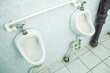 Dirty urinals in public toilet for men
