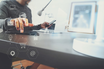 businessman working with smart phone and digital tablet and laptop computer in modern office