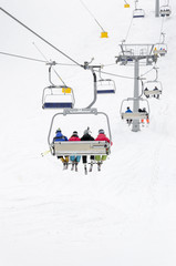 Skiers on ski lift